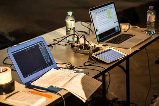 two laptops and tablet on a table